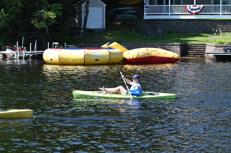 A camper kayaking on Northwood Lake